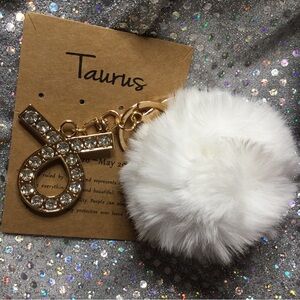 Taurus Gold Keychain with White Fur Pom Pom